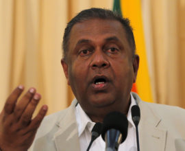 Sri Lankan Foreign Minister Mangala Samaraweera gestures as he speaks at a media briefing in Colombo, Sri Lanka, Thursday, Sept. 17, 2015. Samaraweera said Sri Lanka will begin talks next month on creating a special court to examine alleged atrocities during the country's civil war, in which tens of thousands of people died. (AP Photo/Eranga Jayawardena)
